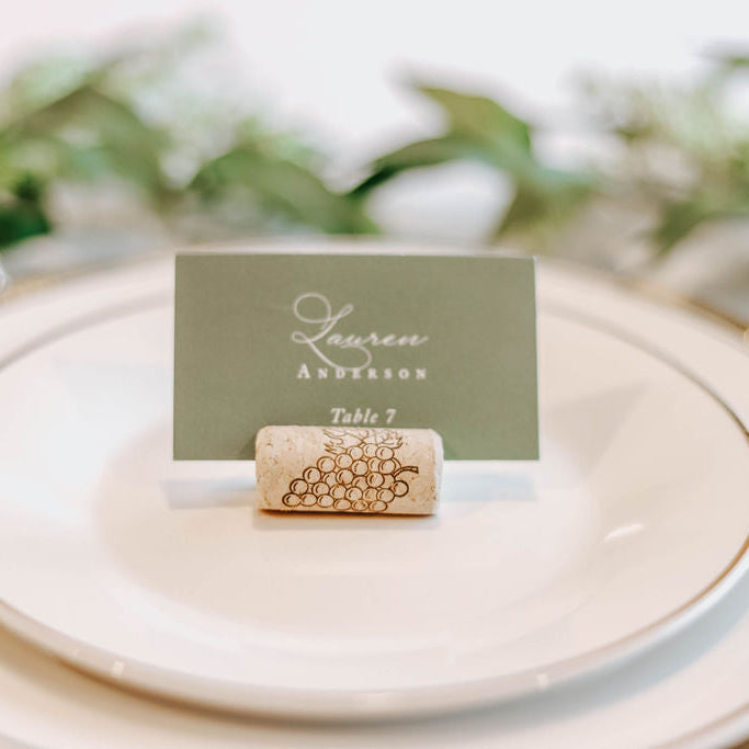 Place card holder with cork and card on a table setting