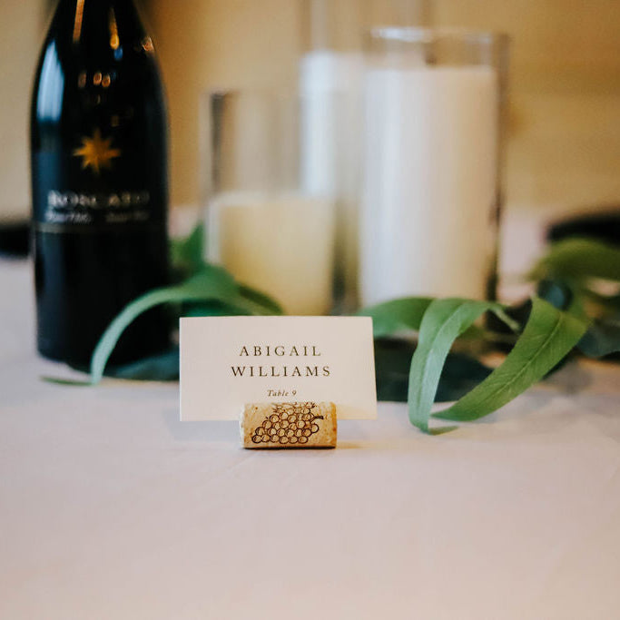 Bottle of wine with a name card on a table