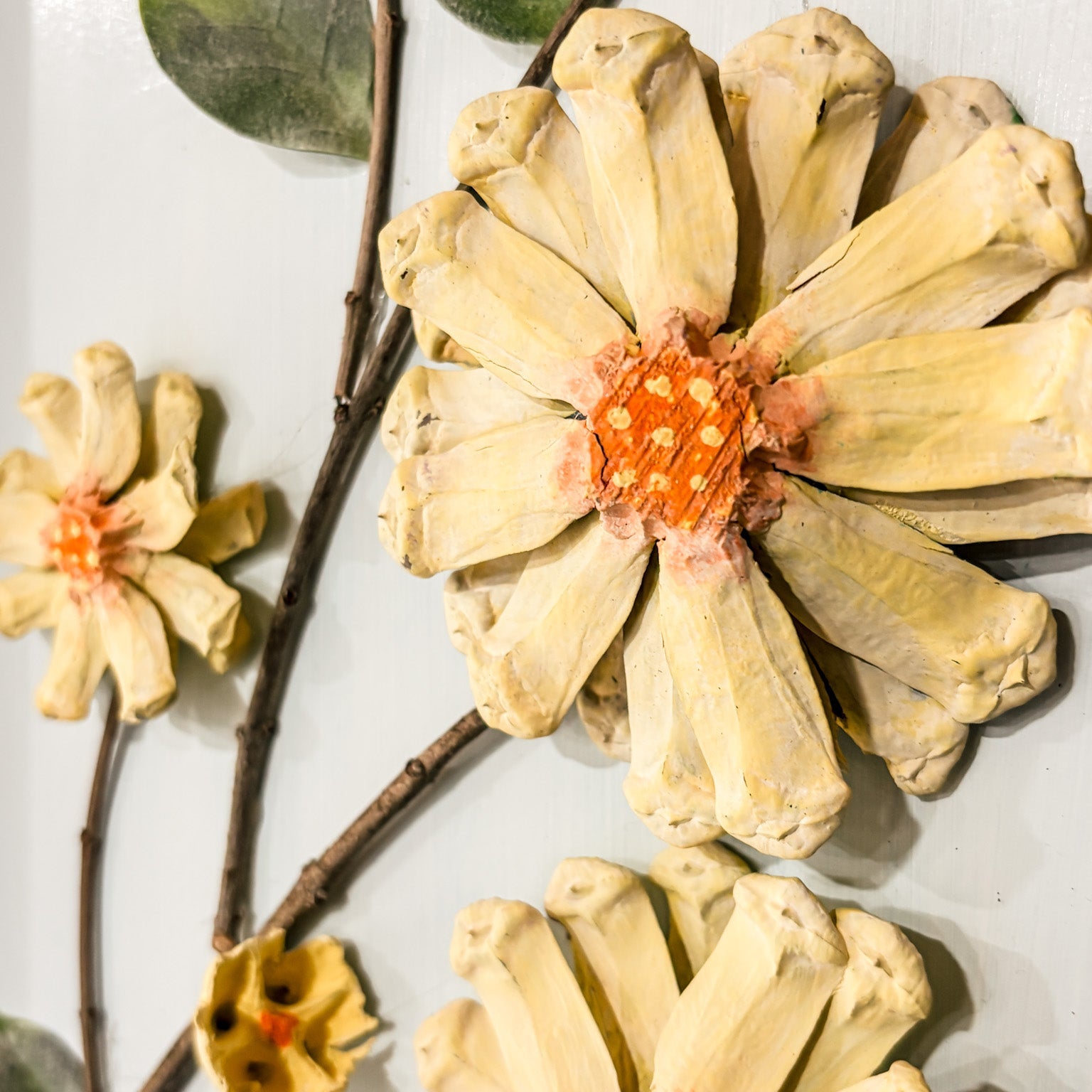 Close-up of dried flowers and branches on a light background
